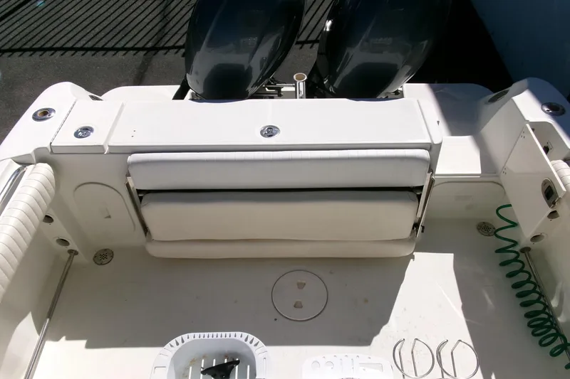 Slide: The Image of 2009 Hydra-Sports 2500 CC boat interior with seating and dual outboard motors. - 24