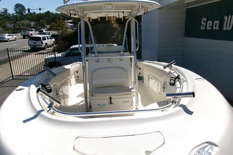 Slide: The Image of 2009 Hydra-Sports 2500 CC boat with T-top and rod holders, parked outdoors. - 28