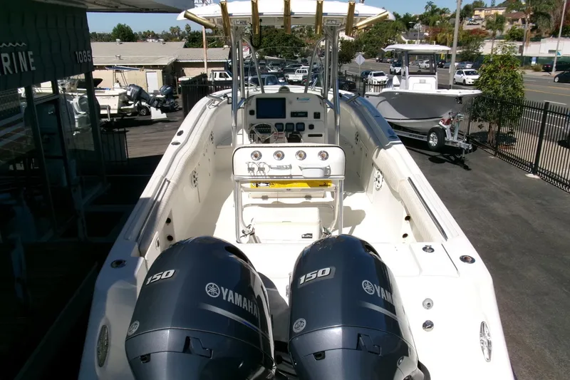 Slide: The Image of 2009 Hydra-Sports 2500 CC boat with dual Yamaha 150 engines, docked outdoors. - 29