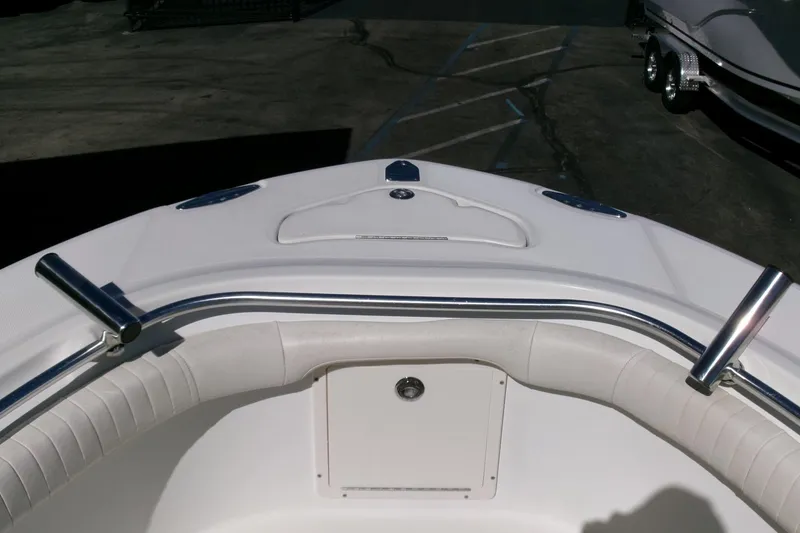 Slide: The Image of 2009 Hydra-Sports 2500 CC boat bow with stainless steel fittings and white seating. - 4