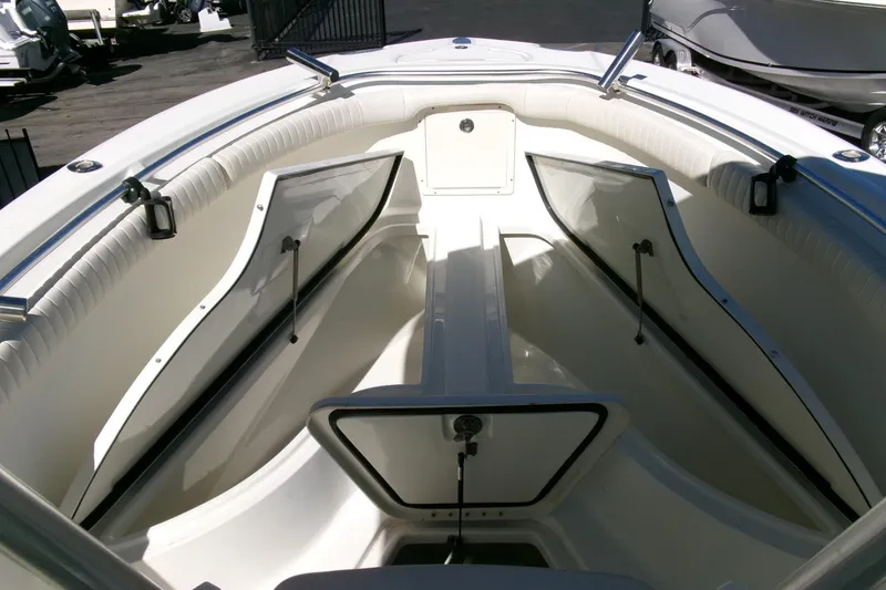 Slide: The Image of 2009 Hydra-Sports 2500 CC boat interior with open storage compartments. - 8