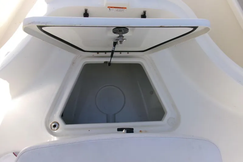 Slide: The Image of Open storage compartment on a 2009 Hydra-Sports 2500 CC boat. - 9