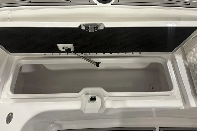 Slide: The Image of Open storage compartment on 2026 Tidewater 3100 Carolina Bay boat, featuring sleek design and ample space. - 11