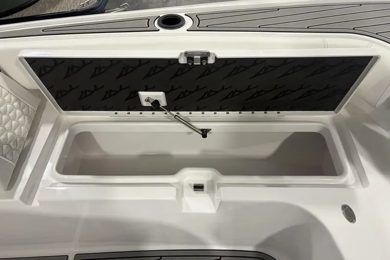 Slide: The Image of Open storage compartment on 2026 Tidewater 3100 Carolina Bay boat, featuring sleek design and functionality. - 13