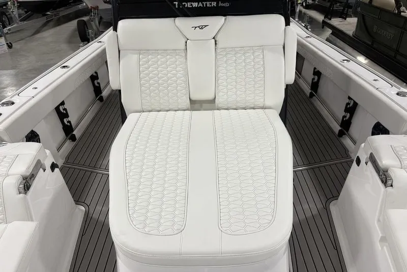 Slide: The Image of 2026 Tidewater 3100 Carolina Bay boat with luxurious white seating and sleek design. - 19