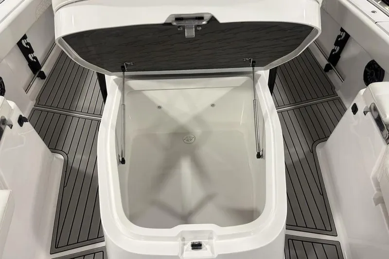 Slide: The Image of Open storage compartment on 2026 Tidewater 3100 Carolina Bay boat, featuring sleek interior design. - 21