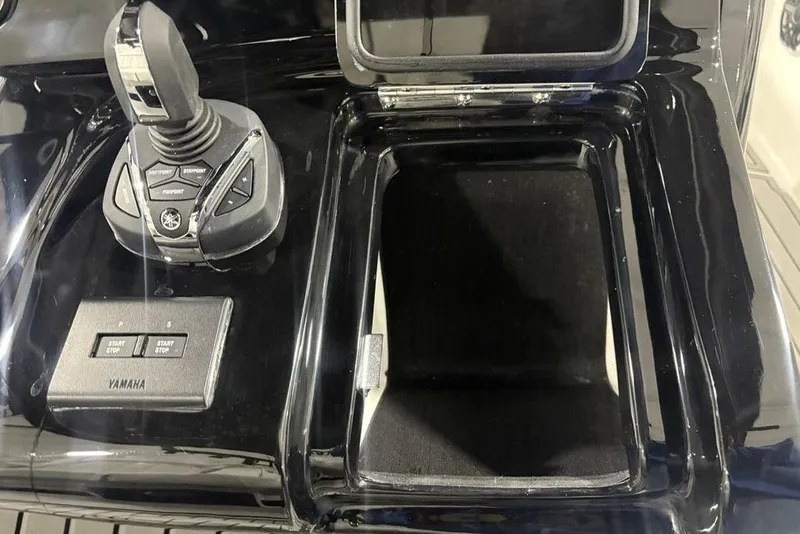 Slide: The Image of Control panel of 2026 Tidewater 3100 Carolina Bay boat with Yamaha joystick and buttons. - 27