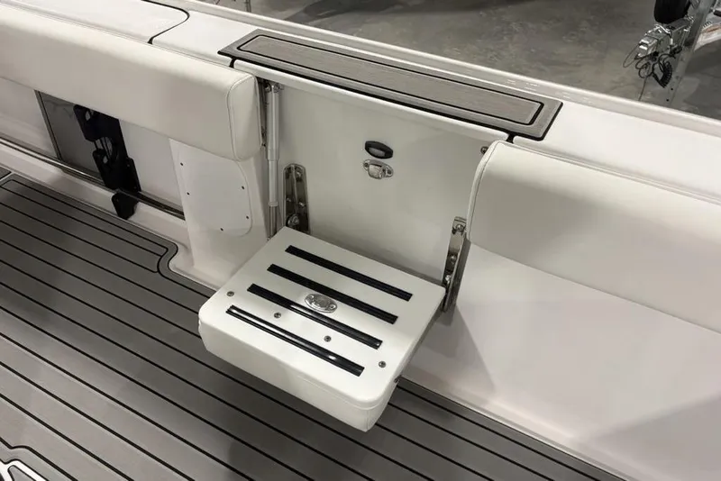 Slide: The Image of 2026 Tidewater 3100 Carolina Bay boat with foldable seat and sleek deck design. - 30