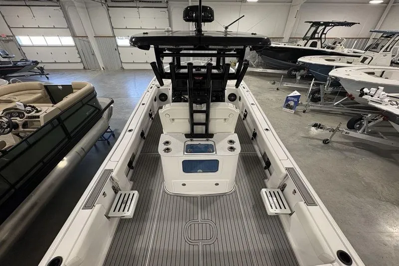 Slide: The Image of 2026 Tidewater 3100 Carolina Bay boat interior in showroom, featuring sleek design and spacious layout. - 31