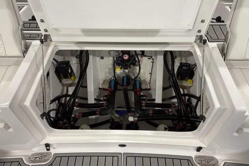 Slide: The Image of 2026 Tidewater 3100 Carolina Bay boat compartment with visible wiring and components. - 33