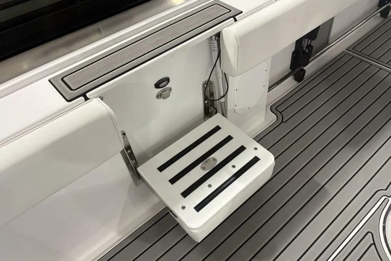Slide: The Image of 2026 Tidewater 3100 Carolina Bay boat with foldable step and sleek deck design. - 38
