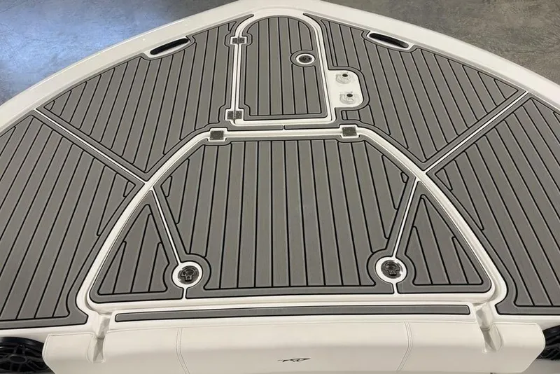 Slide: The Image of Bow deck of 2026 Tidewater 3100 Carolina Bay boat with gray non-slip surface. - 4