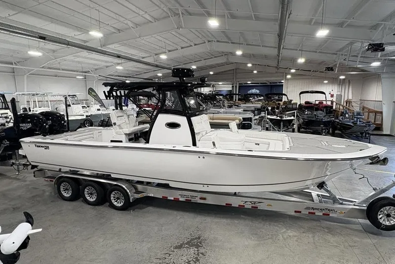 Slide: The Image of 2026 Tidewater 3100 Carolina Bay boat on trailer in showroom. - 6
