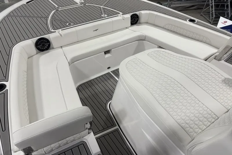 Slide: The Image of 2026 Tidewater 3100 Carolina Bay boat interior with white cushioned seating and sleek design. - 7