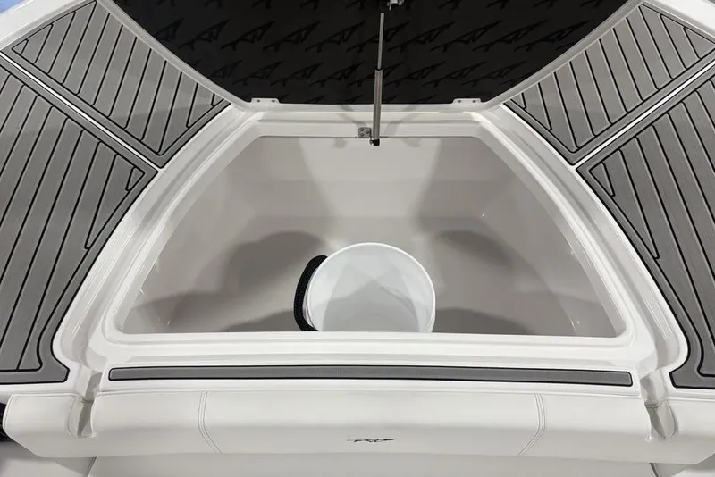 Slide: The Image of 2026 Tidewater 3100 Carolina Bay boat storage compartment with gray non-slip decking. - 8