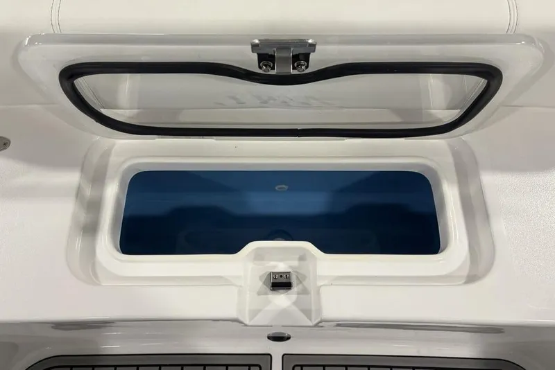 Slide: The Image of Livewell compartment on 2026 Tidewater 3100 Carolina Bay boat, open lid view. - 9