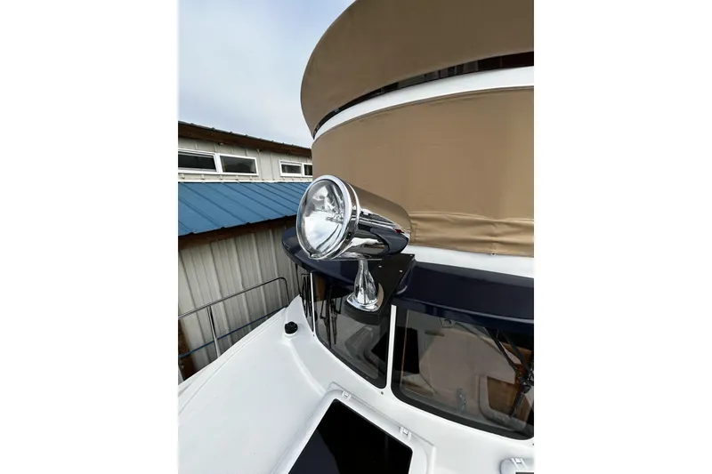 Slide: The Image of 2015 Ranger Tugs R-31 CB spotlight and cabin detail. - 26