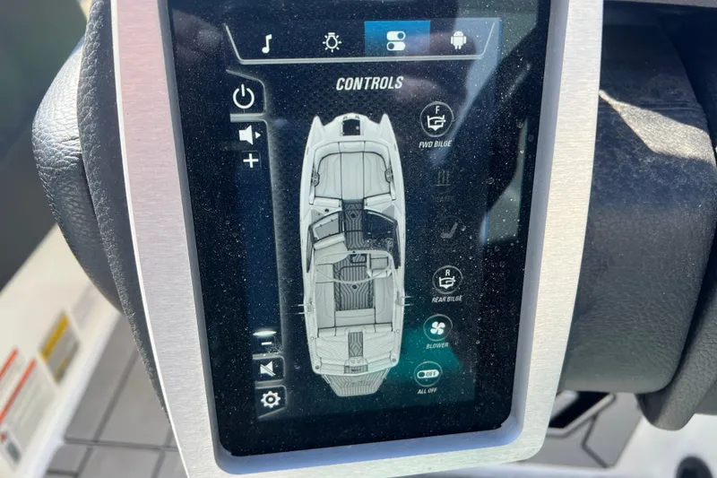 Slide: The Image of Touchscreen controls of a 2020 Malibu Wakesetter 23 MXZ boat dashboard. - 17