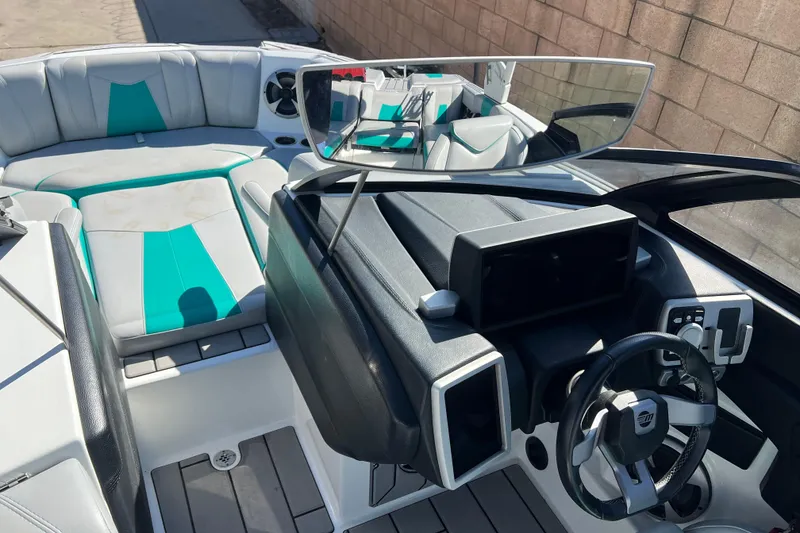 Slide: The Image of 2020 Malibu Wakesetter 23 MXZ interior with modern dashboard and seating. - 26