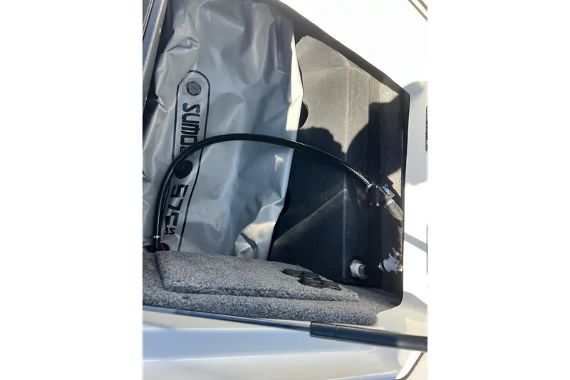Slide: The Image of 2020 Malibu Wakesetter 23 MXZ ballast system with hose and storage compartment. - 32