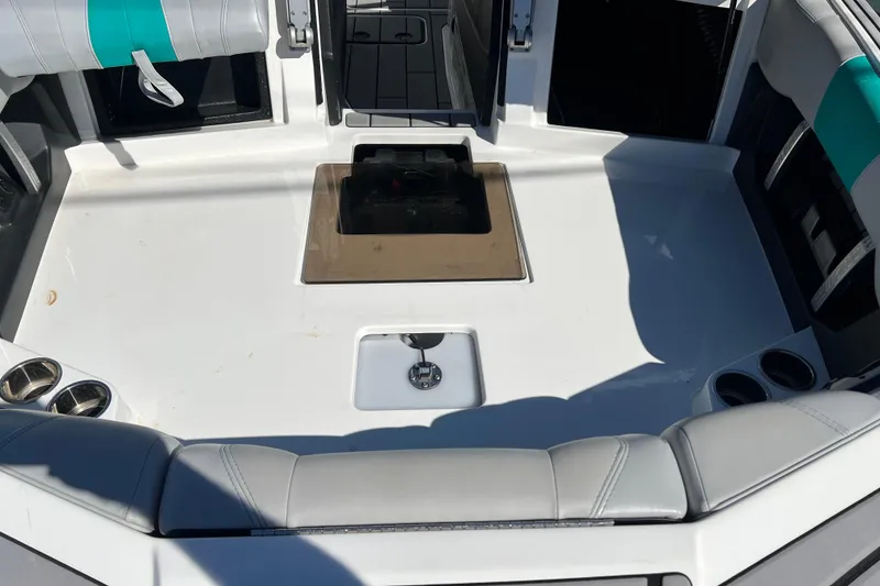Slide: The Image of 2020 Malibu Wakesetter 23 MXZ boat interior with seating and cup holders. - 37