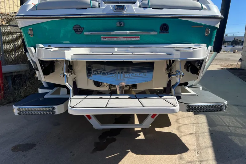 Slide: The Image of 2020 Malibu Wakesetter 23 MXZ boat rear view with swim platform and Power Wedge. - 4