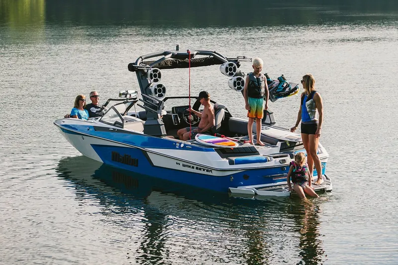 Slide: The Image of Manufacturer Provided Image: 2020 Malibu Wakesetter 23 MXZ boat with people enjoying water activities. - 40