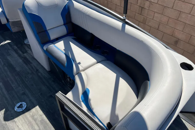 Slide: The Image of 2020 Crest Caribbean RS 250 SLRC boat interior with blue and gray seating. - 15