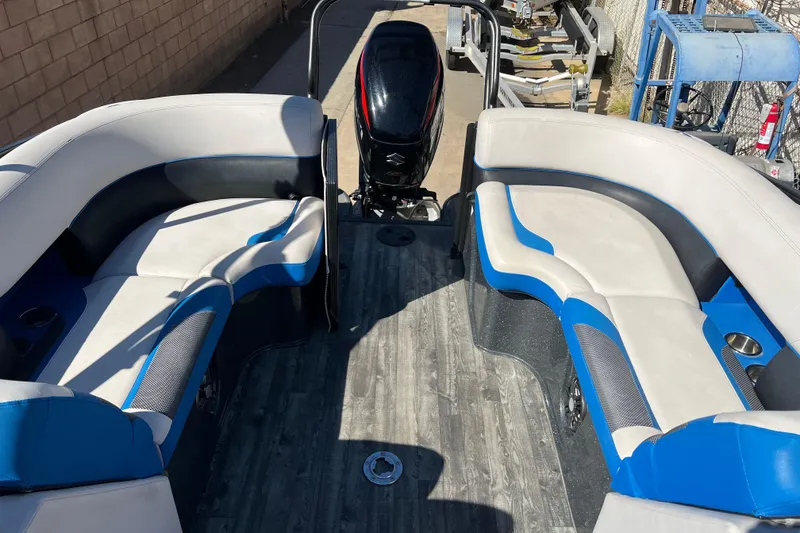 Slide: The Image of 2020 Crest Caribbean RS 250 SLRC boat interior with blue and white seating. - 17