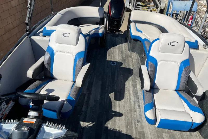 Slide: The Image of 2020 Crest Caribbean RS 250 SLRC boat interior with blue and white seating. - 18