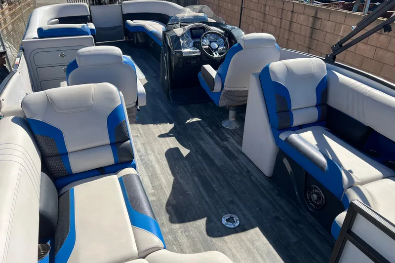 Slide: The Image of 2020 Crest Caribbean RS 250 SLRC boat interior with blue and gray seating. - 19