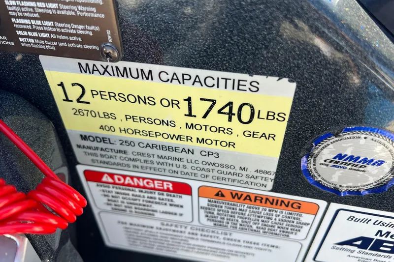 Slide: The Image of 2020 Crest Caribbean RS 250 SLRC capacity label, 12 persons or 1740 lbs, 400 HP motor. - 21