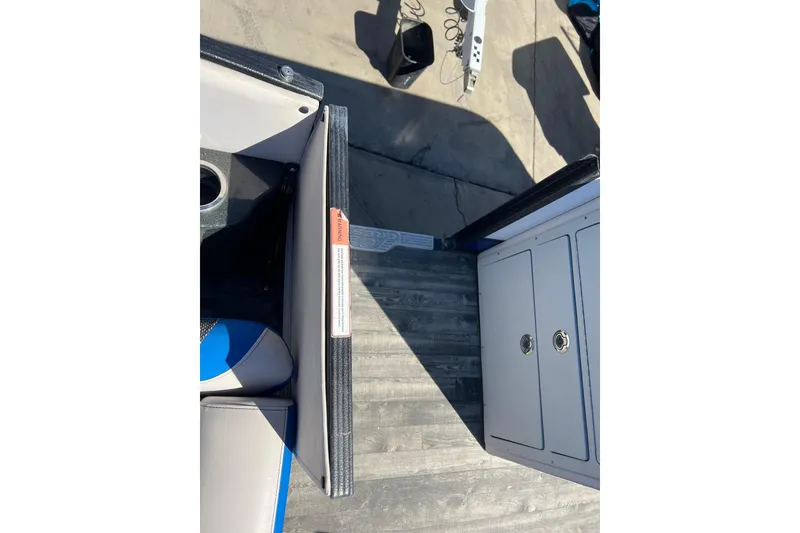 Slide: The Image of 2020 Crest Caribbean RS 250 SLRC boat interior with seating and storage compartments. - 26