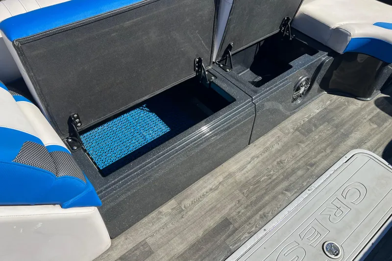 Slide: The Image of 2020 Crest Caribbean RS 250 SLRC boat interior with open storage compartments. - 28