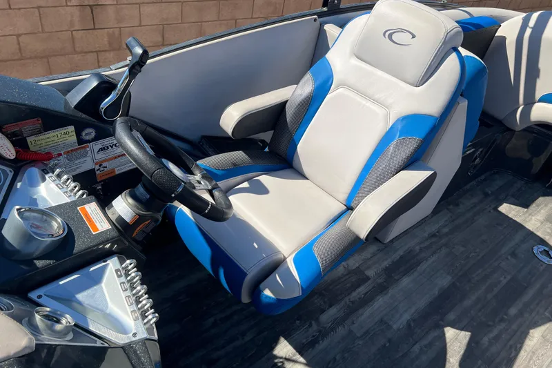 Slide: The Image of 2020 Crest Caribbean RS 250 SLRC boat interior with blue and gray captain's seat. - 5