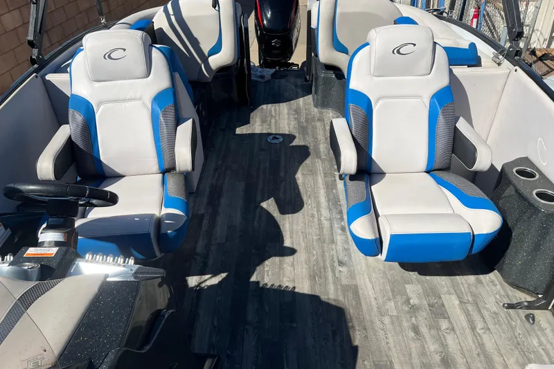 Slide: The Image of 2020 Crest Caribbean RS 250 SLRC boat interior with blue and gray seating. - 6