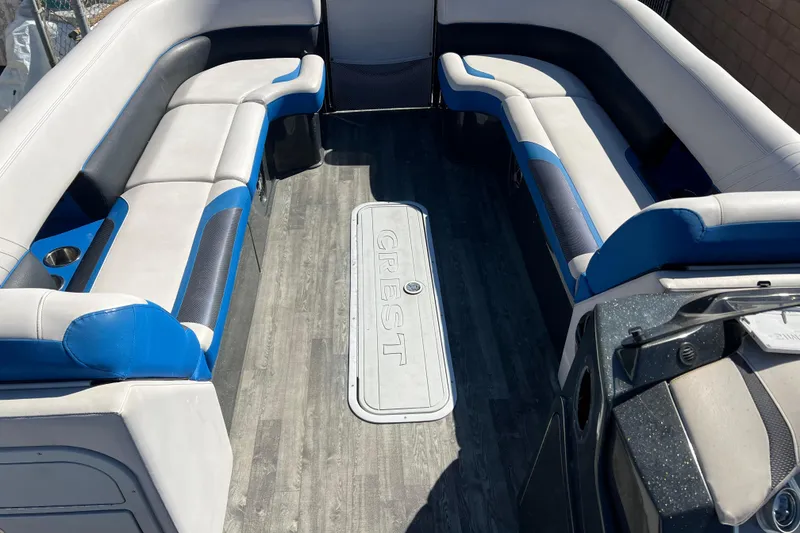 Slide: The Image of 2020 Crest Caribbean RS 250 SLRC boat interior with blue and white seating. - 7