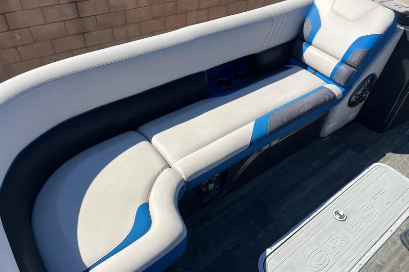 Slide: The Image of 2020 Crest Caribbean RS 250 SLRC boat interior with blue and white seating. - 8