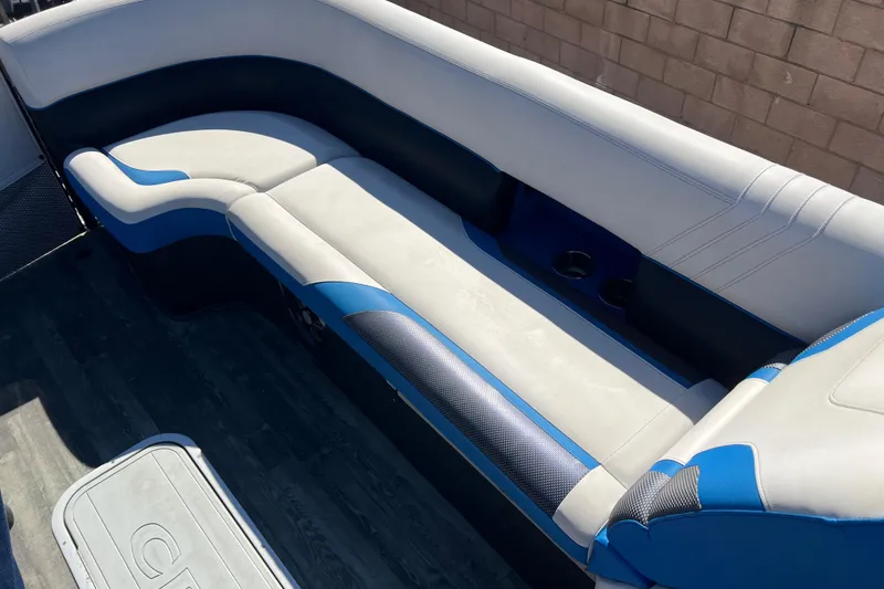 Slide: The Image of 2020 Crest Caribbean RS 250 SLRC boat interior with blue and white seating. - 9