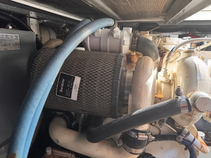 Slide: The Image of Engine compartment of a 1995 Sea Ray 400 Express Cruiser with visible DuraLite filter. - 6