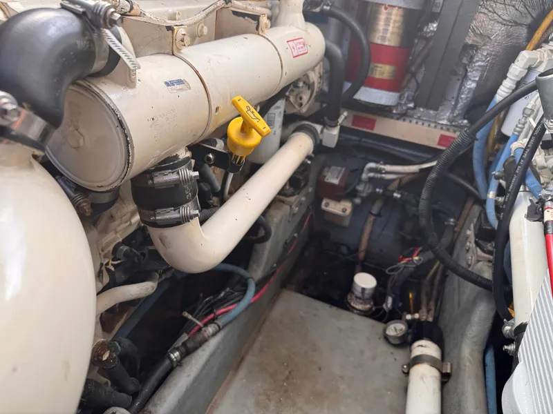 Slide: The Image of Engine compartment of a 1995 Sea Ray 400 Express Cruiser, showcasing mechanical components. - 8