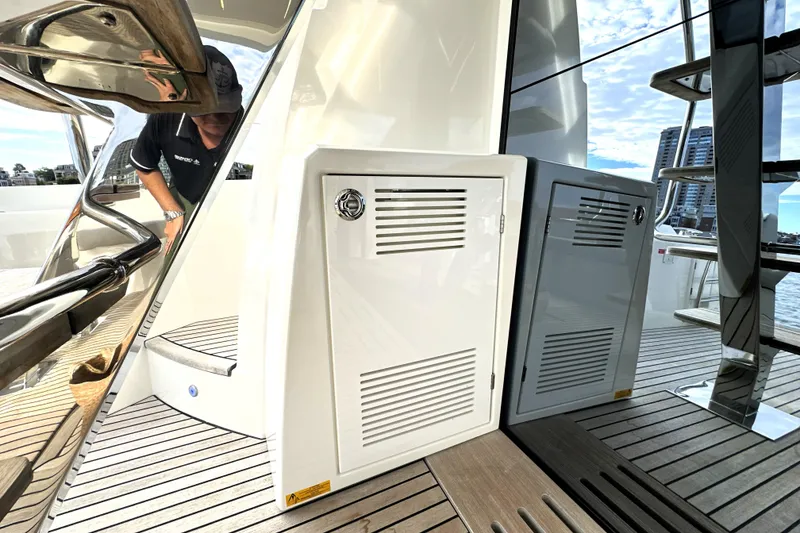 Slide: The Image of 2023 Prestige 590 yacht deck with storage compartments and modern design elements. - 16