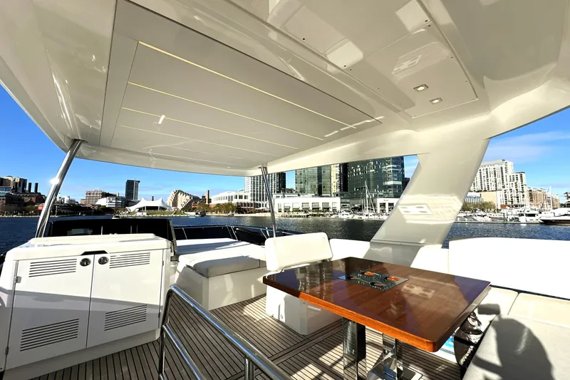 Slide: The Image of Luxurious 2023 Prestige 590 yacht interior with city skyline view. - 21