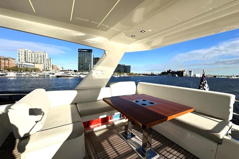 Slide: The Image of Luxurious 2023 Prestige 590 yacht interior with waterfront cityscape view. - 24