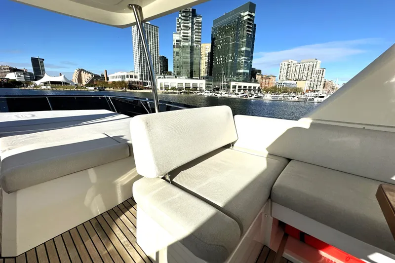 Slide: The Image of Luxury 2023 Prestige 590 yacht interior with city skyline view. - 26