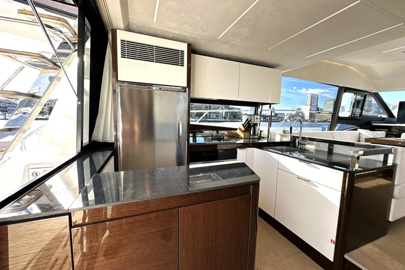 Slide: The Image of Luxurious kitchen interior of 2023 Prestige 590 yacht with modern appliances and sleek design. - 40