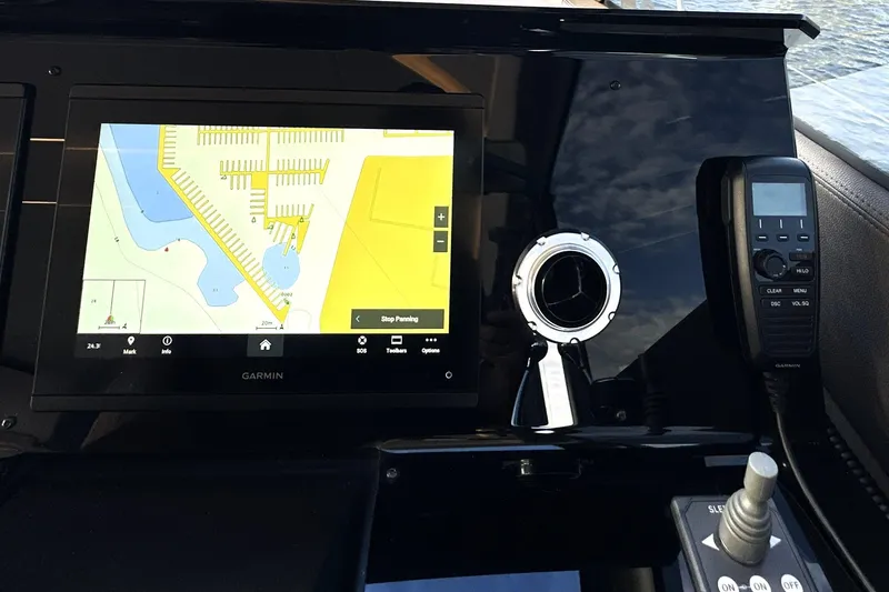 Slide: The Image of Control panel of 2023 Prestige 590 yacht with Garmin navigation display. - 54