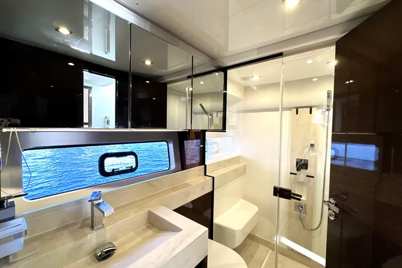 Slide: The Image of Luxurious bathroom interior of 2023 Prestige 590 yacht with modern fixtures and ocean view. - 63