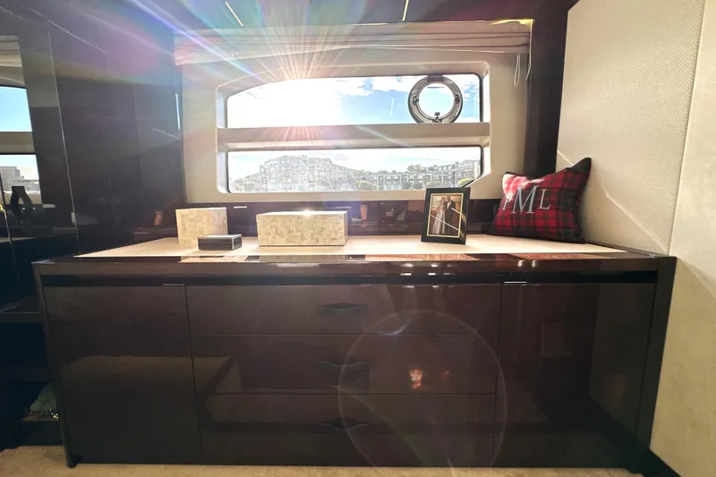 Slide: The Image of Luxurious interior of 2023 Prestige 590 yacht with sunlight streaming through window. - 72