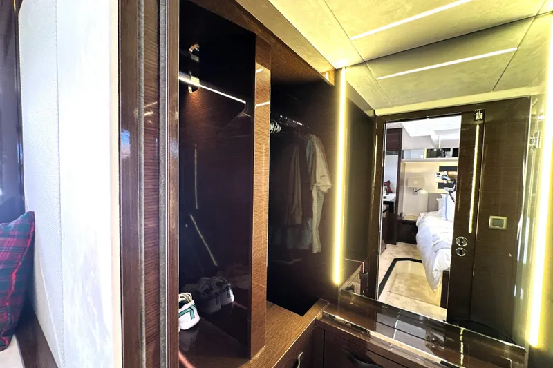 Slide: The Image of Luxurious interior of 2023 Prestige 590 yacht featuring elegant wood finishes and modern lighting. - 75